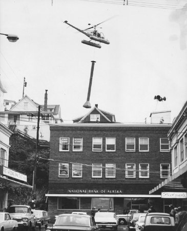 TEMSCO helicopter placing a smokestack on building