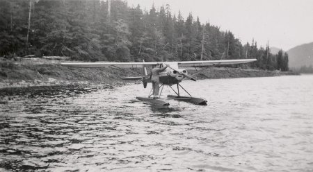 Man standing on the pontoon of a float plane