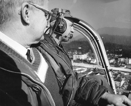 Pilot Kenny Eichner with passenger in helicopter over Ketchikan