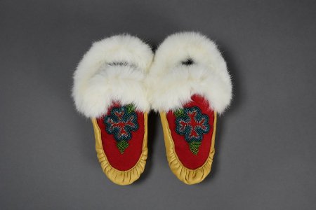Beaded moccasins with blue flower design top