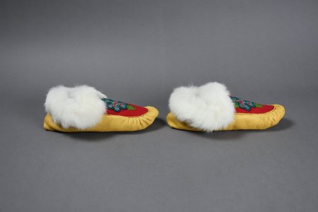Beaded moccasins with blue flower design profile