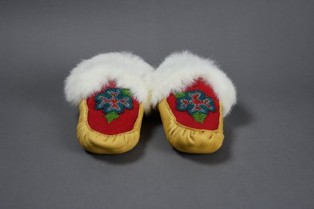 Beaded moccasins with blue flower design front