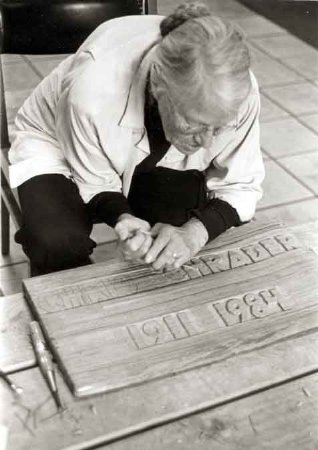 Gertrud Schrader carving marker for the grave of her husband