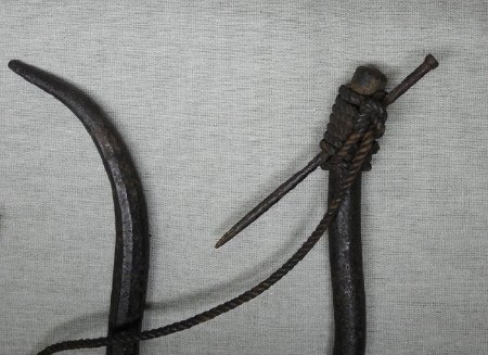Iron hook with nail lashed on