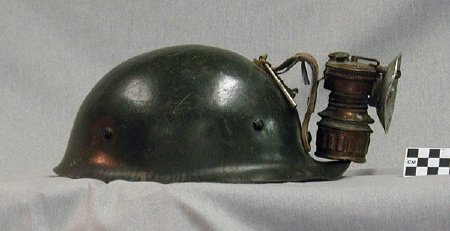 Miner's helmet with carbine head lamp