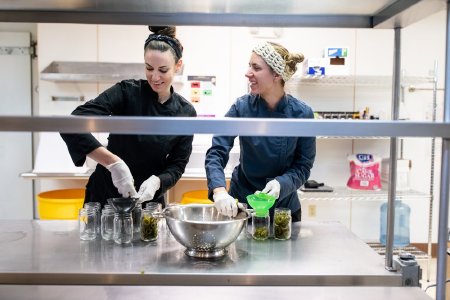 Jenn Brown and Ciarra Perro Packing Jars with Kelp Slices, Nathaniel Wilder