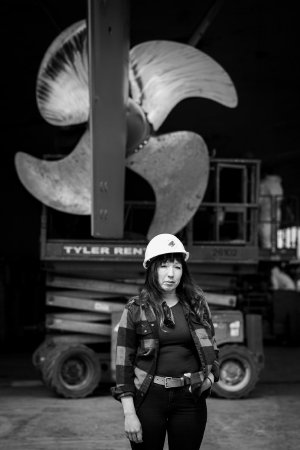 Umeko Seaver, Port Captain Stands in front of Propeller