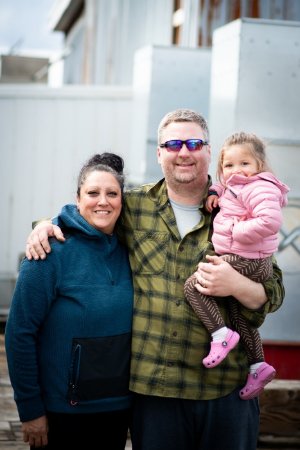 Daniel Marsden Sr. with His Wife Talia and their Granddaughter