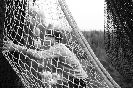 Tosh Ratzat Piles Net Aboard the <i>F/V Alsek</i>