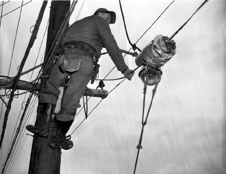 Erling Martinsen stringing cable for KATV, 1953