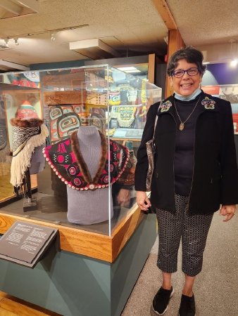 Janice Jackson with her collar on display at the Totem Heritage Center